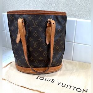 LOUIS VUITTON Monogram Petit Bucket canvas shoulder bag with dust bag.